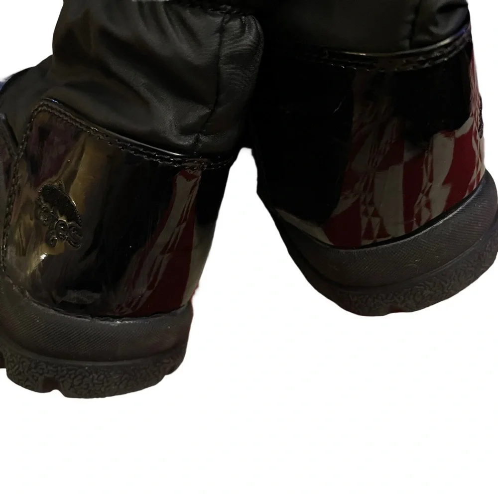 Totes Black snow and rain boots. Lace up “Katey” with zipper on side. Si…